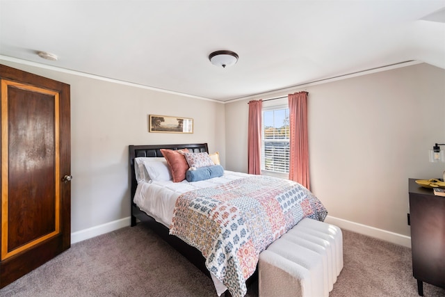 carpeted bedroom with vaulted ceiling