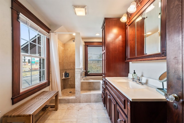 bathroom featuring tile patterned floors, vanity, and plus walk in shower