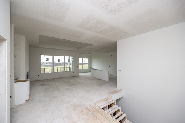 interior space with a raised ceiling