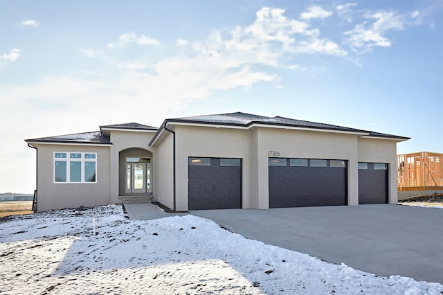 prairie-style house featuring a garage