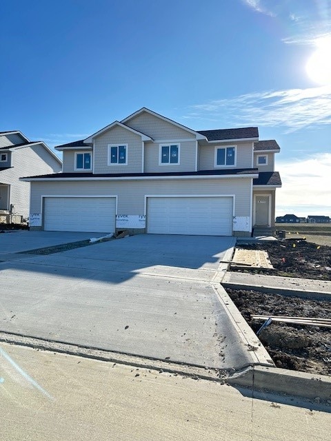 front of property with a garage