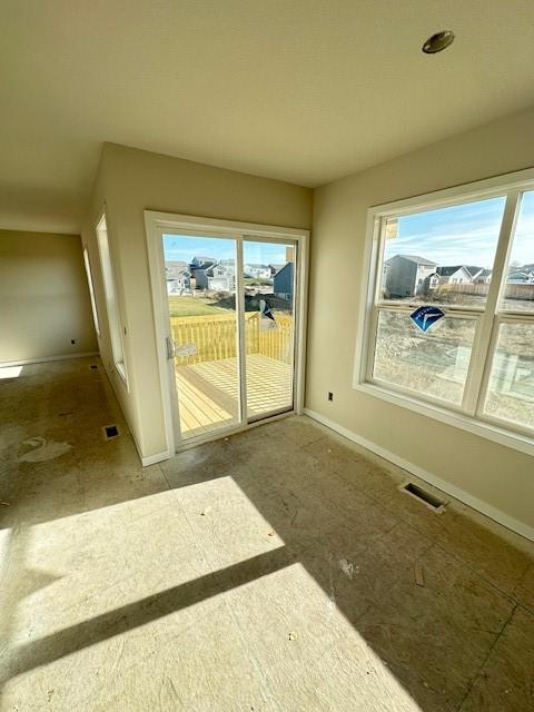 interior space with visible vents and baseboards