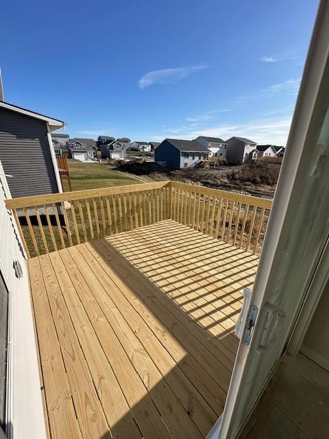 wooden terrace featuring a residential view