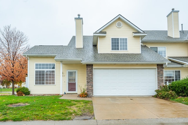 view of front facade featuring a garage and a front lawn