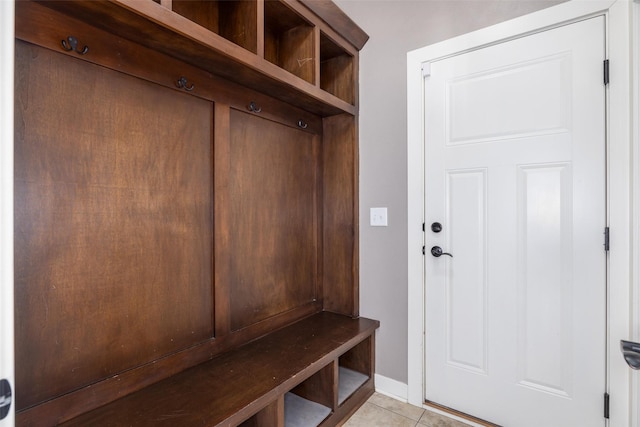 mudroom featuring light tile patterned floors and baseboards