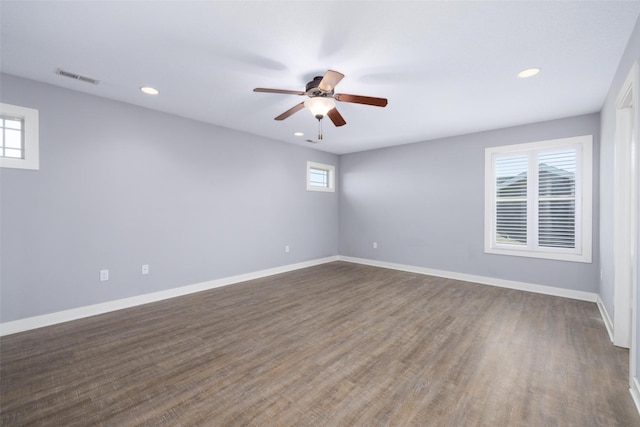 spare room with visible vents, baseboards, and a healthy amount of sunlight