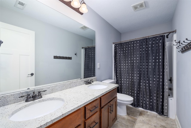 full bath featuring visible vents, toilet, and a sink