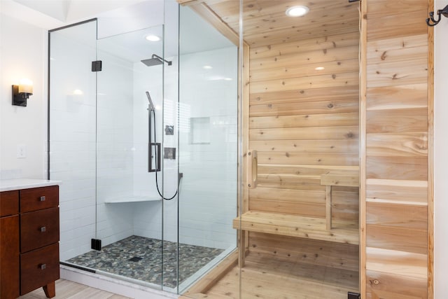 full bath with vanity, a shower stall, and recessed lighting