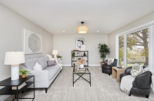 carpeted living room with a textured ceiling