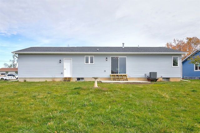 back of house with a yard and cooling unit