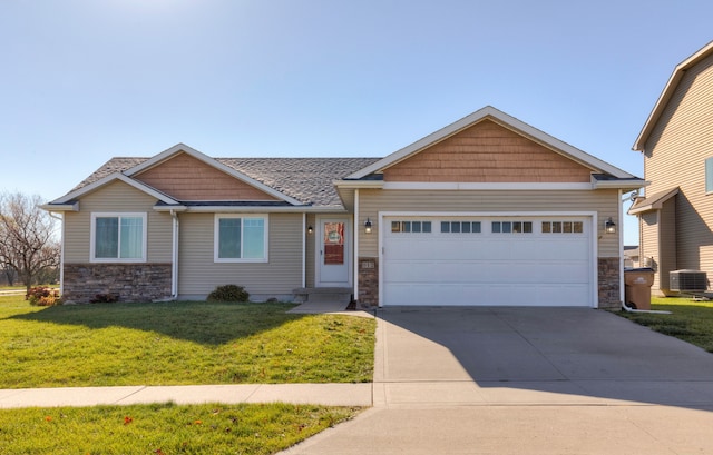 craftsman house featuring a garage, a front lawn, and central air condition unit