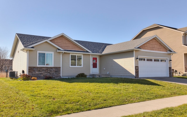 craftsman inspired home featuring a front lawn and a garage