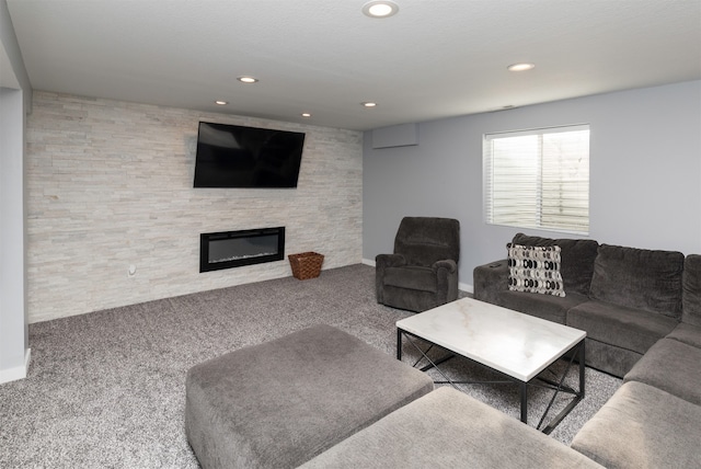 carpeted living room with a fireplace