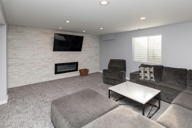 812 SE 15th St, Grimes, IA 50111 - carpeted living room featuring recessed lighting, a large fireplace, and baseboards