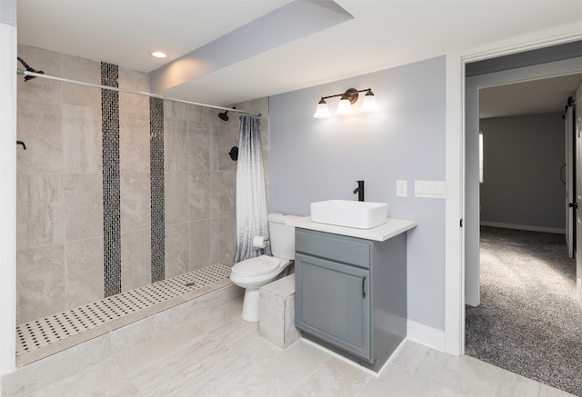 bathroom with a shower with shower curtain, vanity, and toilet