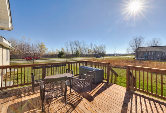 wooden terrace with a yard