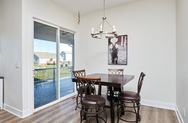 dining room featuring a chandelier and hardwood / wood-style flooring