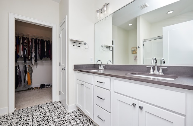 bathroom with vanity and walk in shower