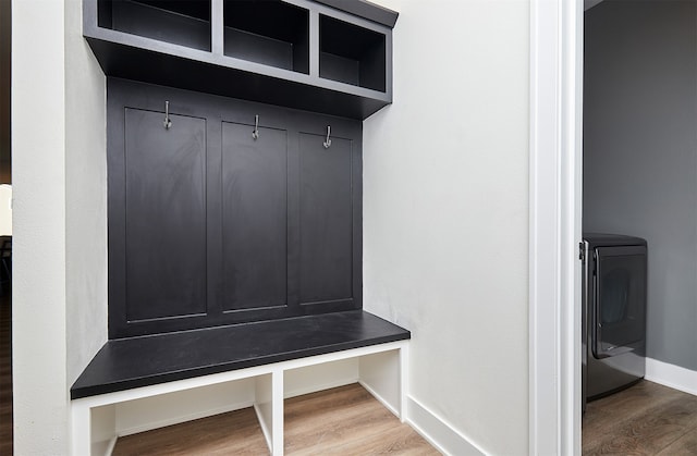 mudroom with hardwood / wood-style floors and washer / dryer