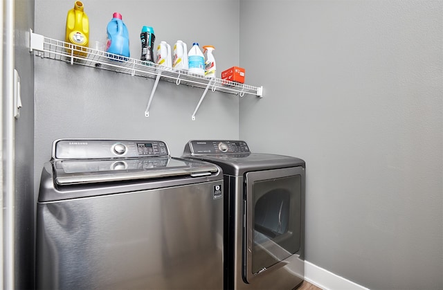 washroom featuring independent washer and dryer