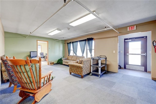 living room featuring light colored carpet and a wealth of natural light