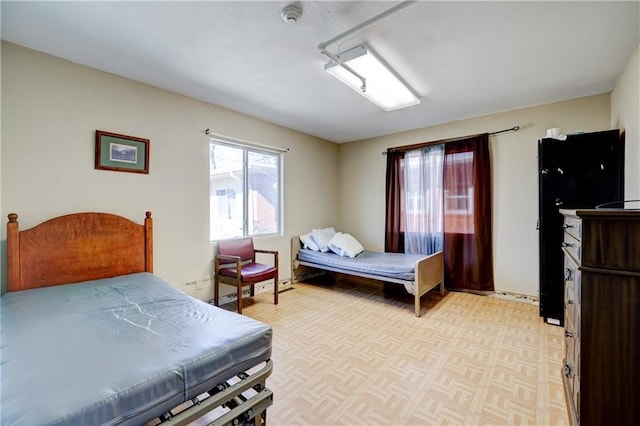 bedroom with light parquet floors