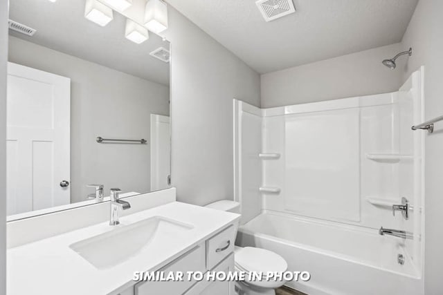 bathroom featuring shower / tub combination, visible vents, toilet, and vanity