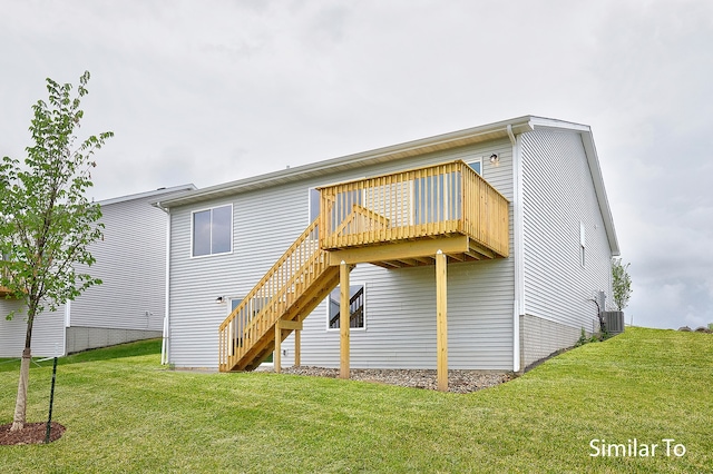 back of property featuring a lawn, central air condition unit, and a deck