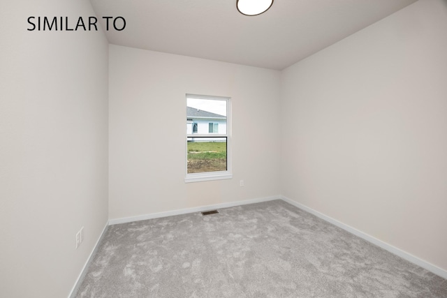 unfurnished room featuring visible vents, baseboards, and carpet floors