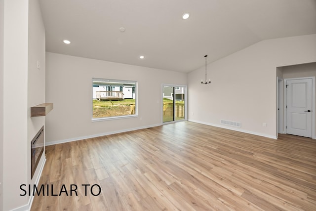 unfurnished living room featuring recessed lighting, visible vents, light wood-style flooring, and lofted ceiling