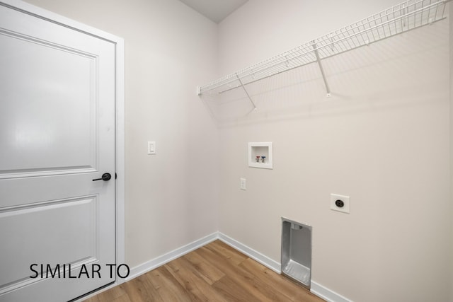 laundry area with baseboards, laundry area, hookup for a washing machine, light wood-style floors, and electric dryer hookup