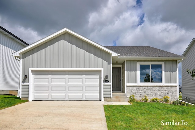 view of front facade with a garage and a front lawn