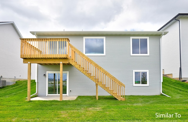 rear view of property featuring a deck, a yard, a patio, and central air condition unit