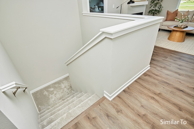 stairway with wood-type flooring