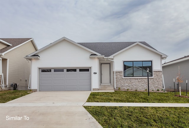 ranch-style home with a front yard and a garage