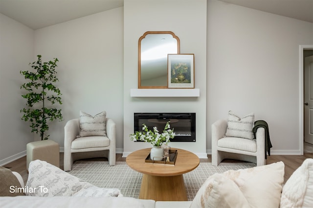 living room with lofted ceiling and hardwood / wood-style flooring