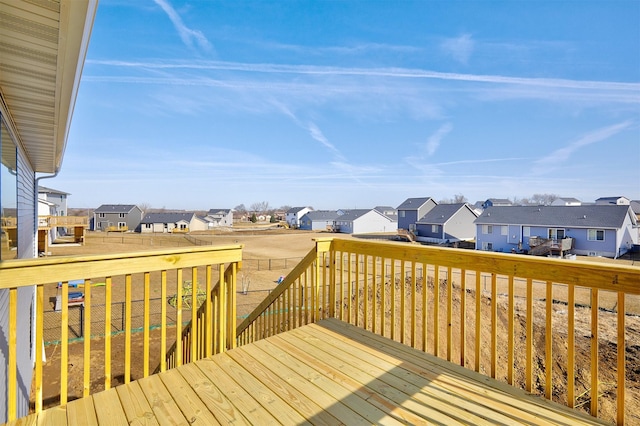 wooden terrace with a residential view