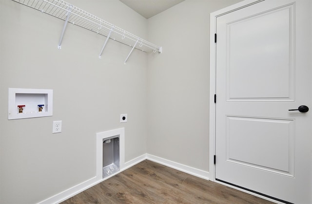 laundry area featuring wood finished floors, baseboards, laundry area, electric dryer hookup, and washer hookup