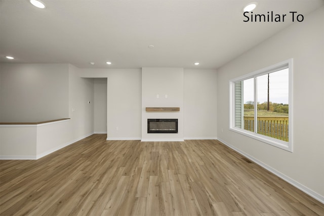 unfurnished living room with light wood-type flooring