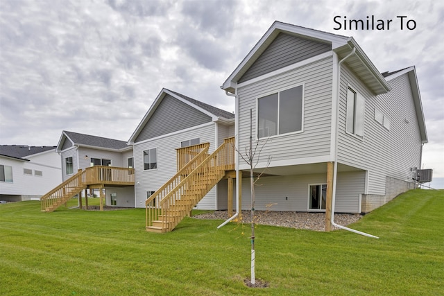 rear view of house featuring a lawn, a wooden deck, and central AC