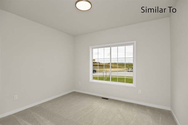 empty room with carpet flooring