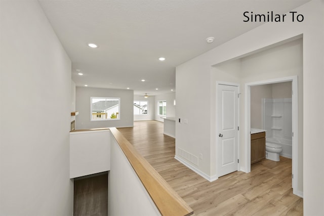 corridor featuring light hardwood / wood-style flooring