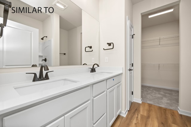 bathroom featuring vanity and hardwood / wood-style flooring