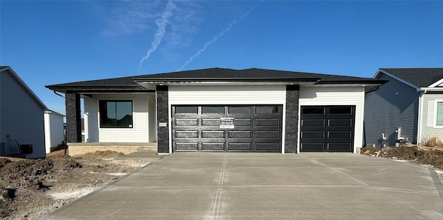 view of front of property featuring driveway and an attached garage