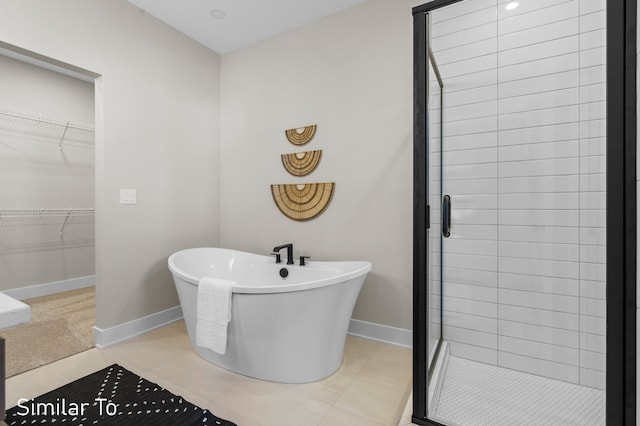 bathroom with plus walk in shower and tile patterned floors