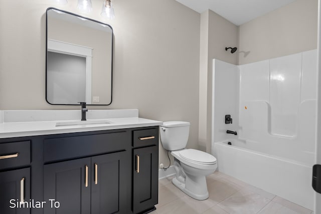 full bathroom featuring tile patterned flooring, vanity, bathtub / shower combination, and toilet