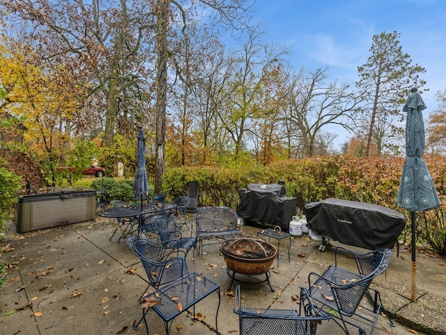 view of patio featuring area for grilling and an outdoor fire pit