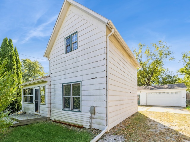 view of side of property with an outbuilding and a garage