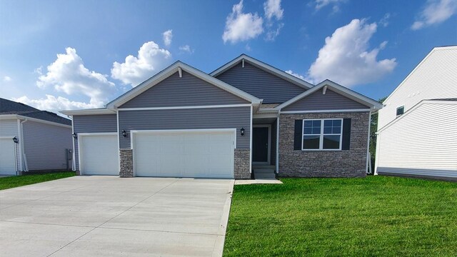 view of front facade with a front yard and a garage