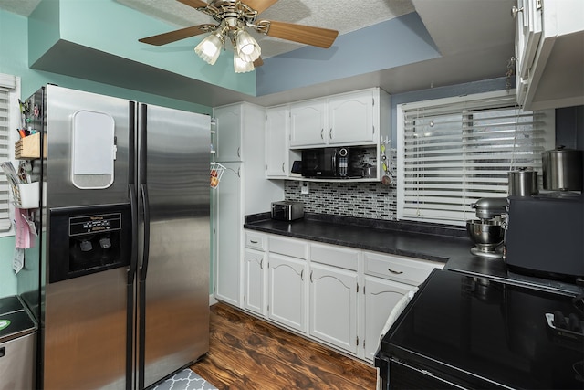 kitchen with tasteful backsplash, black appliances, dark hardwood / wood-style floors, and white cabinets